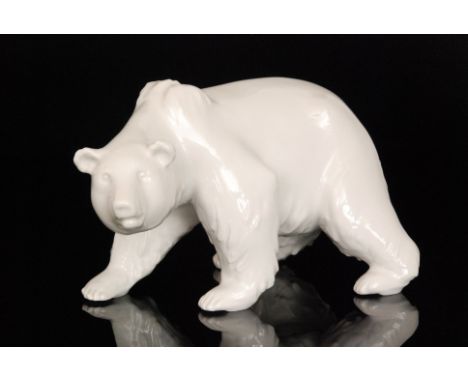 A 20th Century Berlin blanc de chine model of a Polar Bear, underglaze spectre mark, length 23cm