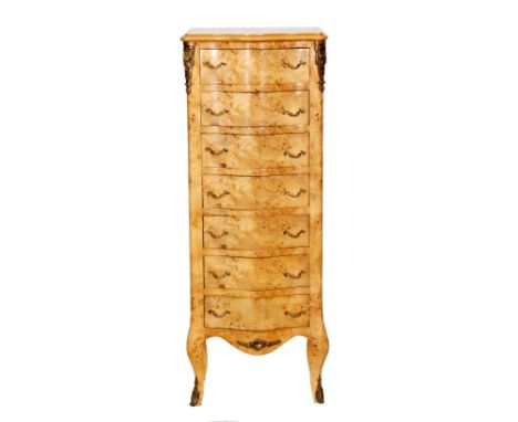 A 20th Century French style serpentine fronted light walnut chest of seven drawers, with gilt metal mounts on cabriole legs, 