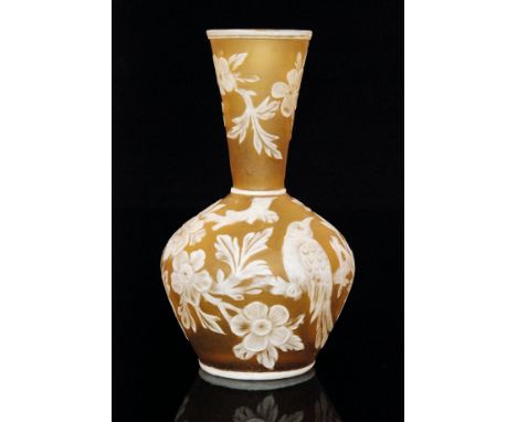 A late 19th Century Thomas Webb & Sons cameo glass vase of low shouldered form with a flared collar neck, cased in opal over 