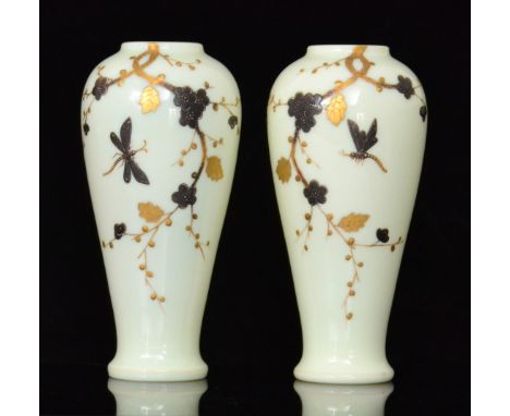 A pair of late 19th Century Harrach vases of footed shouldered ovoid form with shallow collar necks, relief gilt and silver d