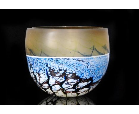 A contemporary studio glass bowl by Stephen Foster of circular form decorated with a tonal blue and white marbled pick up ove