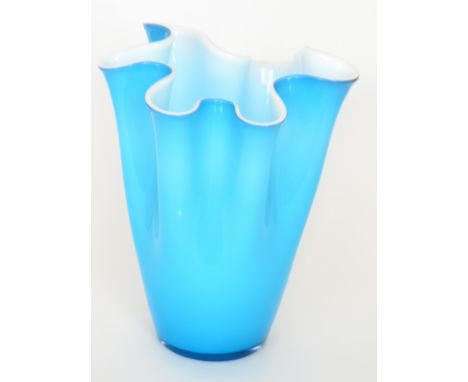 A large later 20th Century Italian Murano glass vase of cylindrical form with wide waved rim, cased in translucent blue over 