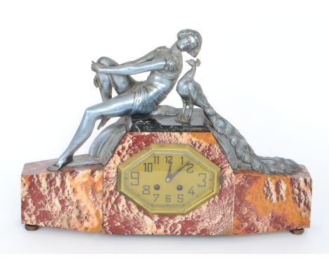 A 1930s Art Deco marble and spelter eight day mantle clock, rouge veined marble base encompassing gilt octagonal dial below s
