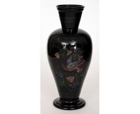 A late 19th Century black glass vase of footed shouldered ovoid form with flared collar neck, acid cut in the Aesthetic taste