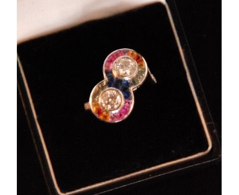 A contemporary 18ct white gold double headed multi coloured sapphire and diamond ring, two collar set diamonds, each approxim