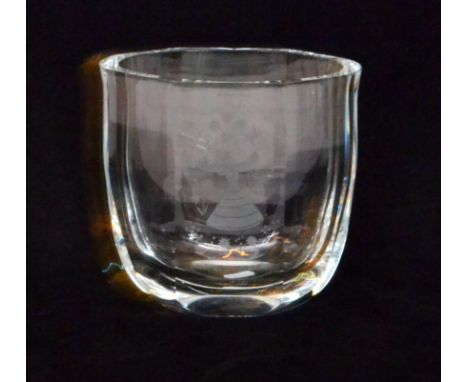 A post-war Orrefors crystal glass vase of compressed facet form, engraved with a stylised female figure dancing amongst flowe
