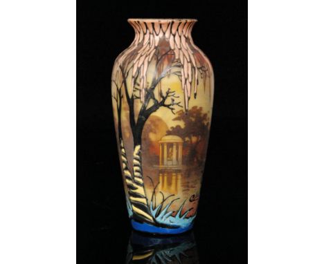 A 1930s French Art Deco glass vase of slender shouldered ovoid form with flared collar neck, enamel decorated with a stylised