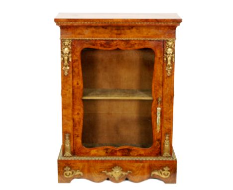 A 19th Century Louis XIV style crossbanded and line inlaid gilt metal mounted pier cabinet enclosed by a shaped glazed door o