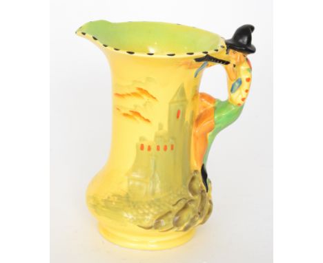 A 1930s Burleigh Ware novelty Pied Piper flower jug relief moulded with a castle landscape and figural handle picked out in e