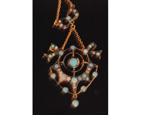 A Victorian style silver gilt opal and diamond set open work pendant detailed with stylised bows and suspended from fine trac