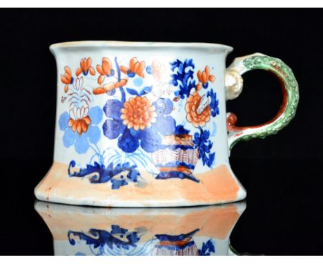 A large 19th Century Masons Ironstone oversized tankard decorated in iron red and underglaze blue with vases of oriental flow