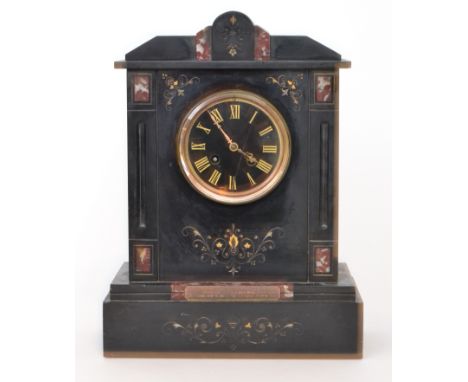 A late Victorian eight day strike black slate mantle clock, gilt Roman numerals to a black circular dial below scroll apex pe