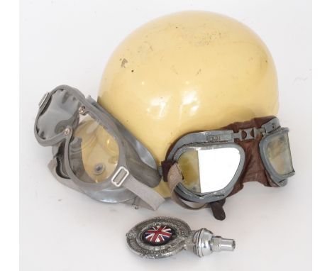 An early 20th Century boxed Herbert and Johnson motorcycle helmet and visor together with two pairs of goggles and a Royal Au