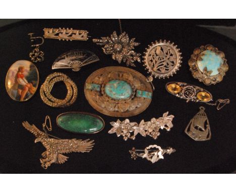 A small parcel lot of brooches to include a ceramic oval portrait of boy on a haystack within 9ct mount, Victorian and Edward