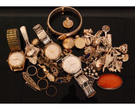 A small parcel lot of assorted jewellery to include watches, silver charm bracelet, brooches, bangle, pendants etc. 