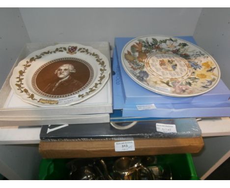 shelf of Wedgwood plates and collectors book