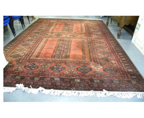 A BOKHARA PATTERN CARPET 