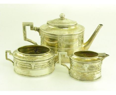 A GERMAN SILVER NEO CLASSICAL STYLE OVAL THREE PIECE TEA SERVICE EMBOSSED WITH SWAGS, MAKER'S AND CONTROL MARKS, CIRCA 1900, 