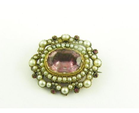 AN EARLY VICTORIAN FOILED AMETHYST, RUBY AND SPLIT PEARL MOURNING BROOCH, LOCKET BACK, CIRCA 1840