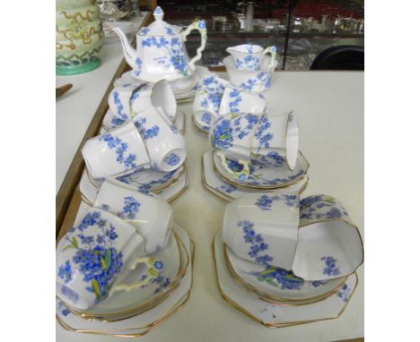 A ROYAL STAFFORD BONE CHINA TEA SERVICE DECORATED WITH SPRAYS OF BLUE FLOWERS