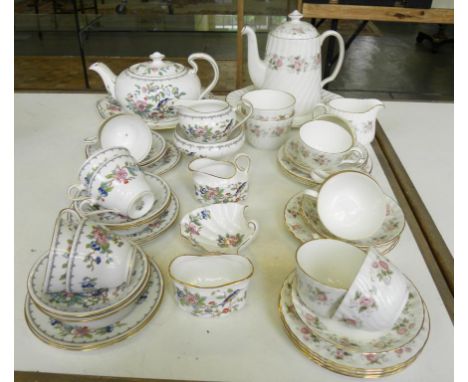 AN AYNSLEY BONE CHINA PEMBROKE PATTERN TEA SERVICE AND A MINTON BONE CHINA SPRING BOUQUET PATTERN TEA SERVICE