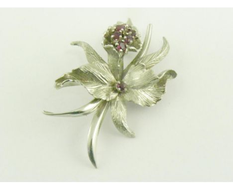 A RUBY AND WHITE GOLD ORCHID BROOCH, 10.3G