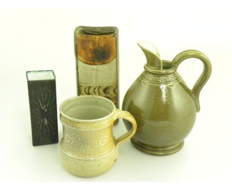 A TROIKA SQUARE VASE, A WINCHCOMBE POTTERY  MUG, A SIMILAR STUDIO POTTERY OLIVE GLAZED JUG AND A SLAB FORM VASE