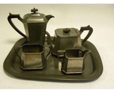 AN HAMMERED PEWTER FIVE PIECE TEA SERVICE, EARLY 20TH CENTURY
