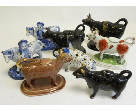 A FRENCH FAIENCE PIG TOOTHPICK (?) HOLDER, A PAIR OF DUTCH DELFTWARE FIGURES OF FARMERS AND CATTLE AND SIX VARIOUS VICTORIAN 