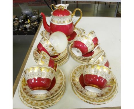 A SHELLEY CLARET GROUND TEA SERVICE AND SET OF THREE SHELLEY WILD FLOWERS PATTERN PLATES 