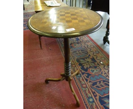 A VICTORIAN WALNUT TRIPOD GAMES TABLE WITH ROUND TOP