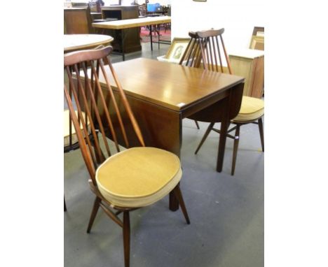 A SET OF FOUR ERCOL STICK BACK DINING CHAIRS, A DROP LEAF DINING TABLE AND A REPRODUCTION MAHOGANY WALL UNIT