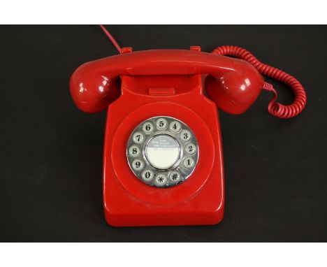 A vintage style red acrylic dial up telephone.  H.13 W.13 D.21cm. 