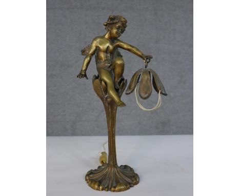 A gilded Art Nouveau cherub and flower design brass table lamp. H.33 Diam.11cm 