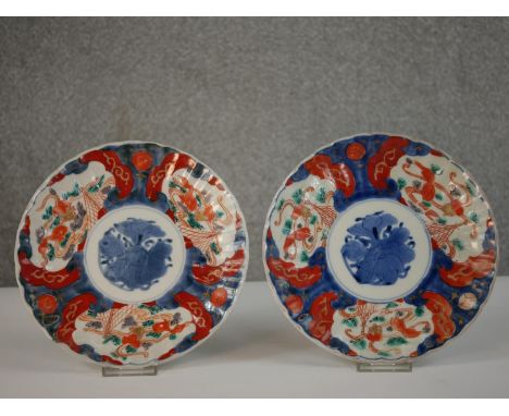 Two 20th century Japanese Imari ceramic plates decorated with goldfish.  Diam.22cm 