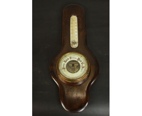 An early 20th century aneroid barometer and thermometer, with a painted enamelled dial. H.53 W.20 D.5cm. 
