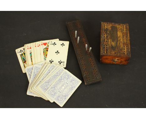 Two treen early 20th century cribbage sets one with vintage playing cards. H.5 W.11 D.8cm. (largest) 