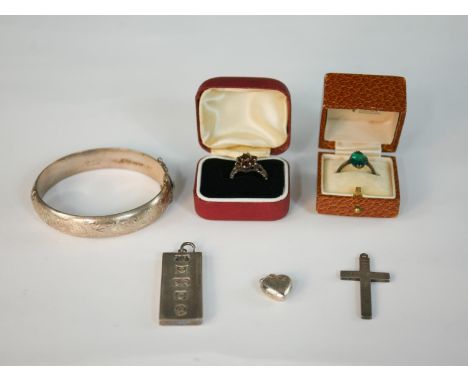 A collection of antique silver jewellery, including a silver and garnet cluster ring, a silver and paste ring, a silver ingot