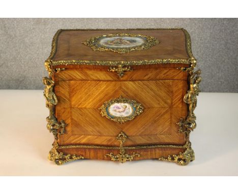 A 19th century French Louis XV style kingwood decanter box, quarter veneered and crossbanded, with gilt metal mounts and Sevr