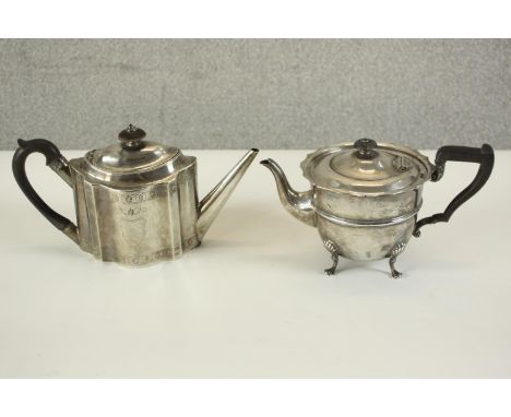 Two sterling silver tea pots with ebony handles. One Edwardian with engraved armorial crest, hall marked: HW for Lee &amp; Wi