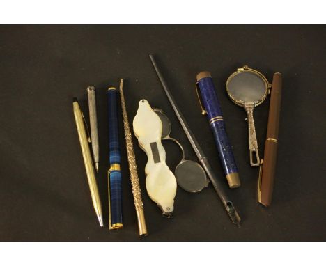 A collection of vintage and antique pens and other items. A mother of pearl cased pair of lorgnettes, a pair of Art Deco engr