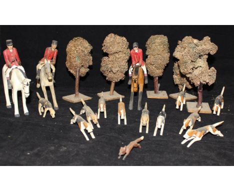 A collection of early 20th Century carved wooden  painted hunting figures comprising three horses, three huntmen, fox and ele