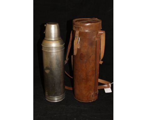 A vintage Thermos flask housed in a leather carrying case