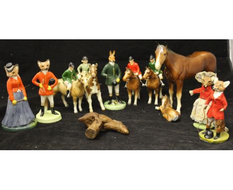 A Beswick figure of girl up on pony and various other figures on ponies and porcelain hunting related figures and a resin wal