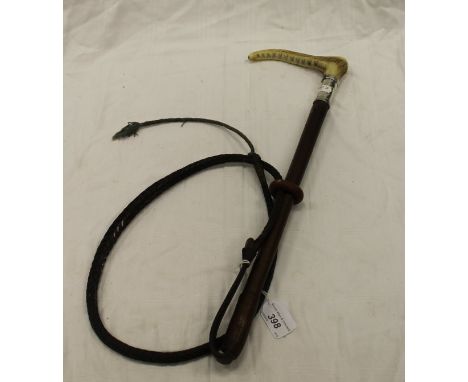 A gent's hunting whip with antler handle and silver ferrule to plain leather shaft with plaited leather thong, the silver fer