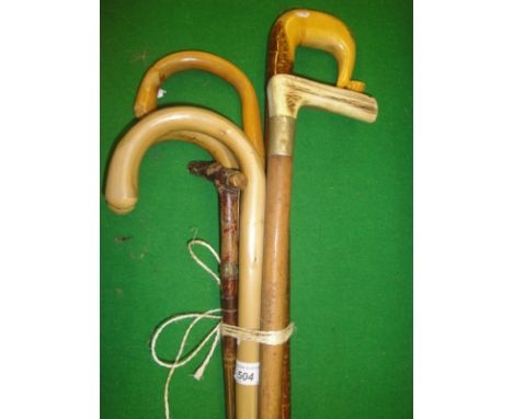 Six assorted walking sticks to include antler handled example together with a Brexton's picnic hamper with fitted interior (3