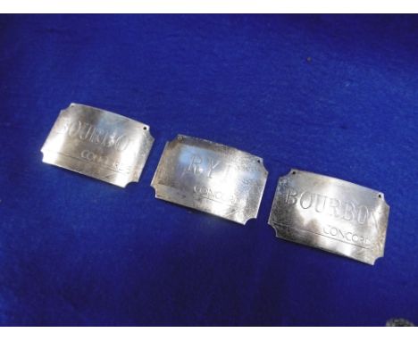 THREE SILVER DECANTER LABELS, ENGRAVED CONCORDE, TWO BOURBON AND ONE RYE