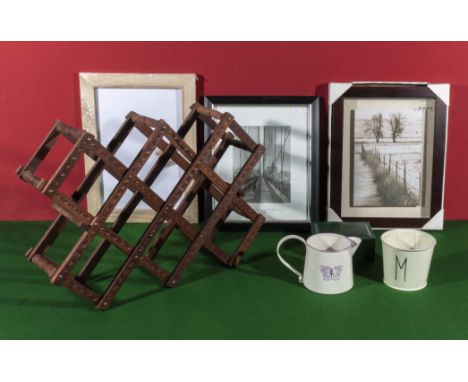 A wine rack, three prints and two pieces of enamel ware