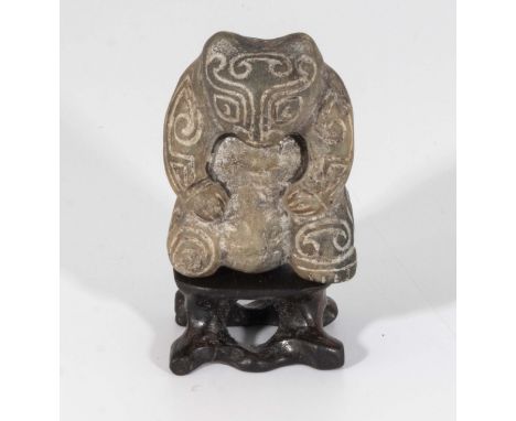 A Shang dynasty style mythical beast hardstone jade with stand