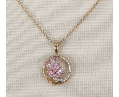 A 9ct gold chain with a gold pendant set with diamonds and pink stones